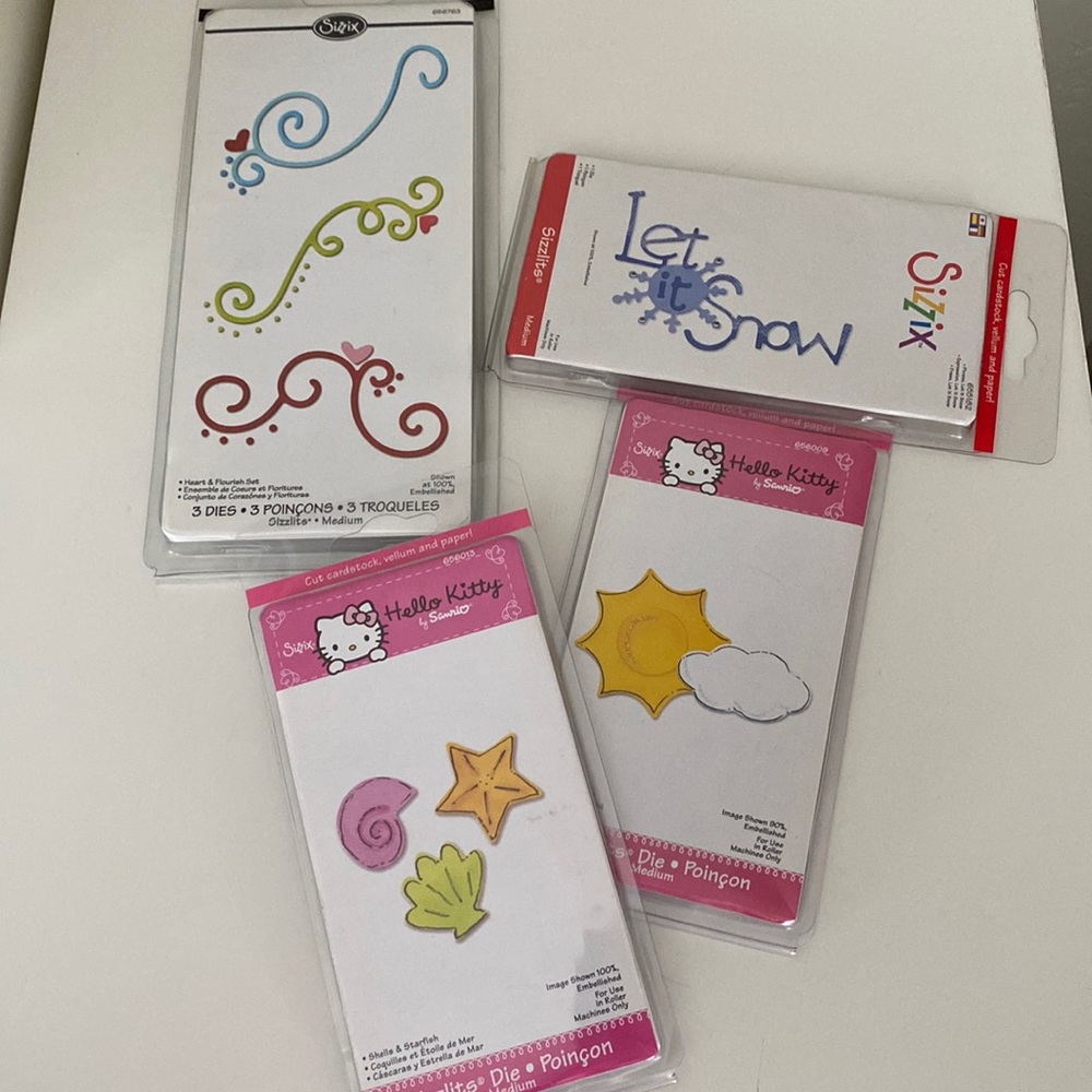 4 Packages Sizzix Medium Sizzlits Dies Hello Kitty, Flourishes, Snow Phrase New - Picture 1 of 5